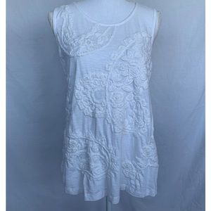White on white embroidered sleeveless top.